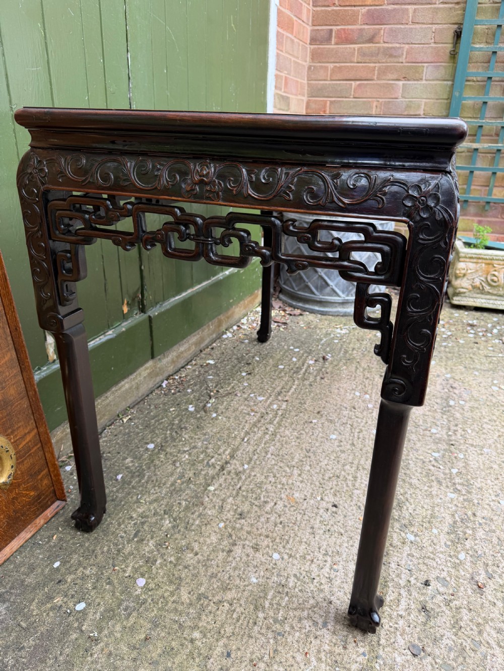 Late 19th-century Chinese Qing Dynasty dark hardwood centre table featuring an inset pink rouge marble rectangular top and intricately carved fretwork aprons. View IX
