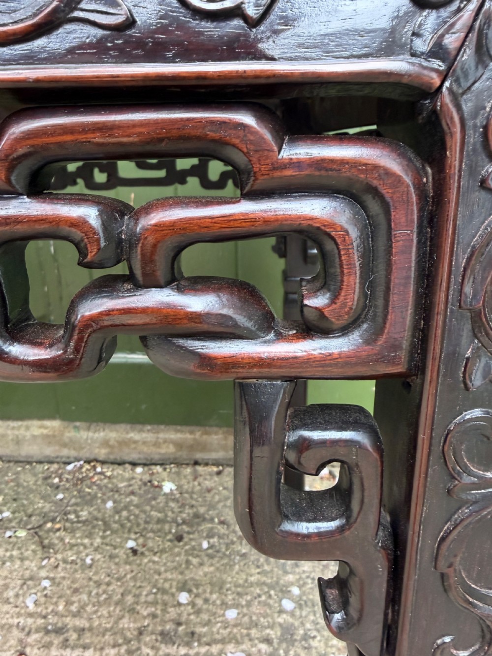 Late 19th-century Chinese Qing Dynasty dark hardwood centre table featuring an inset pink rouge marble rectangular top and intricately carved fretwork aprons. View XII