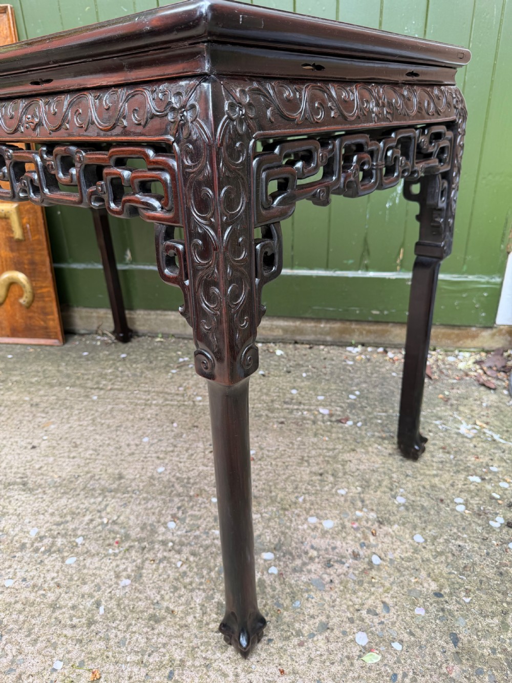 Late 19th-century Chinese Qing Dynasty dark hardwood centre table featuring an inset pink rouge marble rectangular top and intricately carved fretwork aprons. View XVI