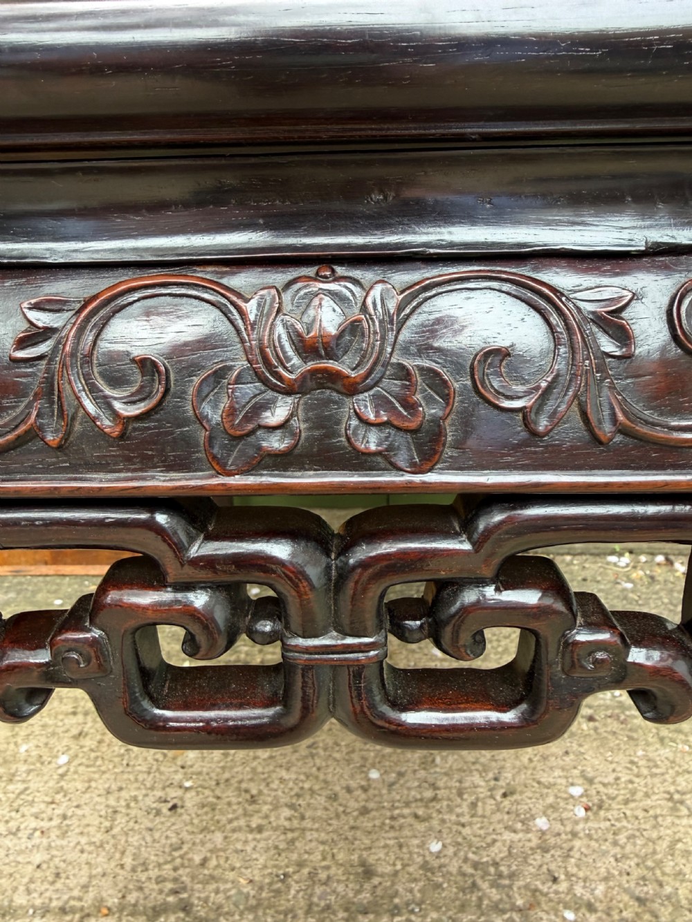 Late 19th-century Chinese Qing Dynasty dark hardwood centre table featuring an inset pink rouge marble rectangular top and intricately carved fretwork aprons. View XXI