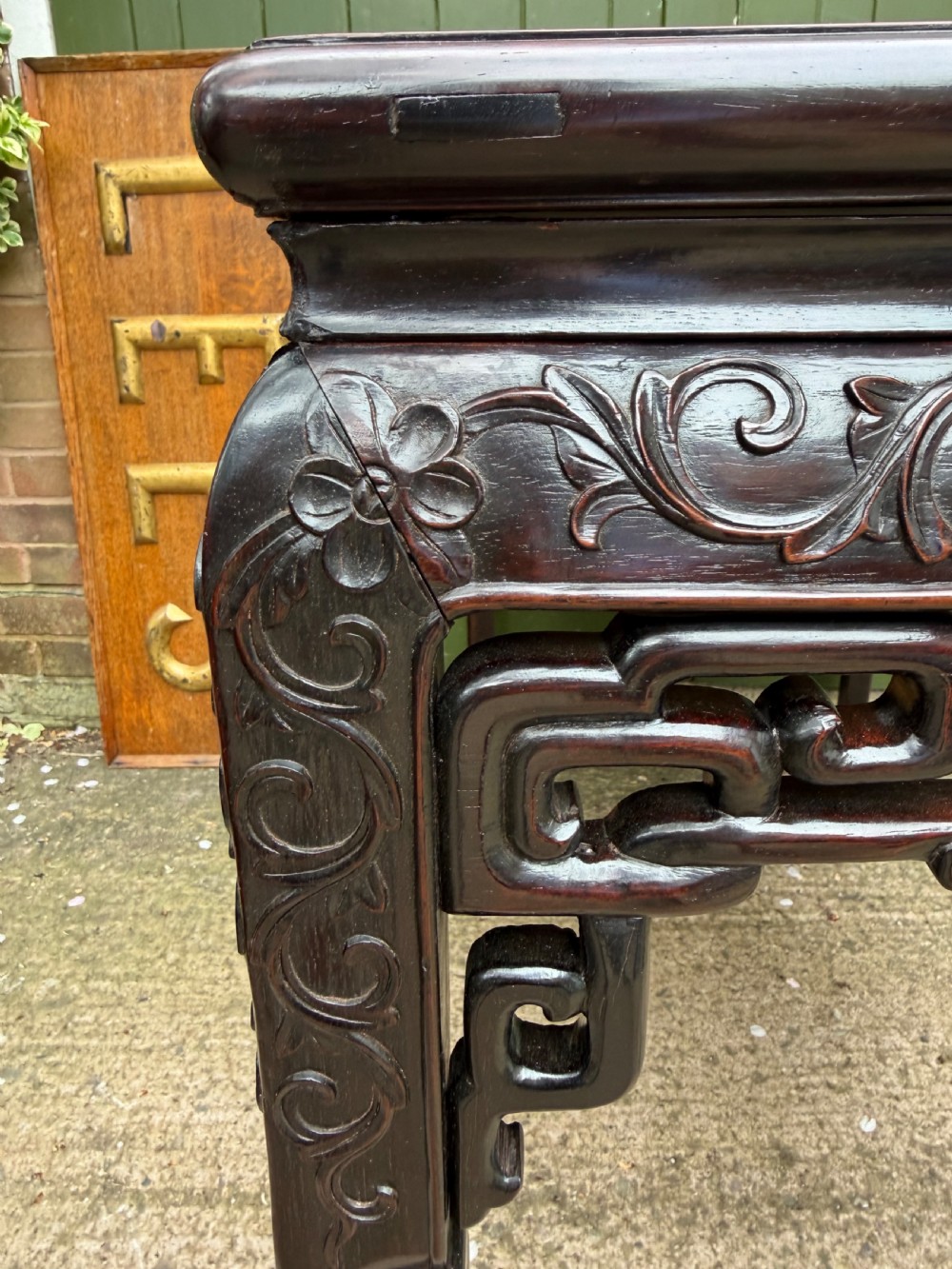 Late 19th-century Chinese Qing Dynasty dark hardwood centre table featuring an inset pink rouge marble rectangular top and intricately carved fretwork aprons. View XXII