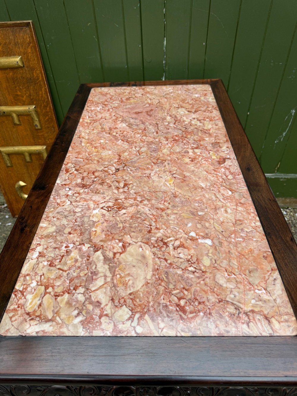 Late 19th-century Chinese Qing Dynasty dark hardwood centre table featuring an inset pink rouge marble rectangular top and intricately carved fretwork aprons. View XXIII