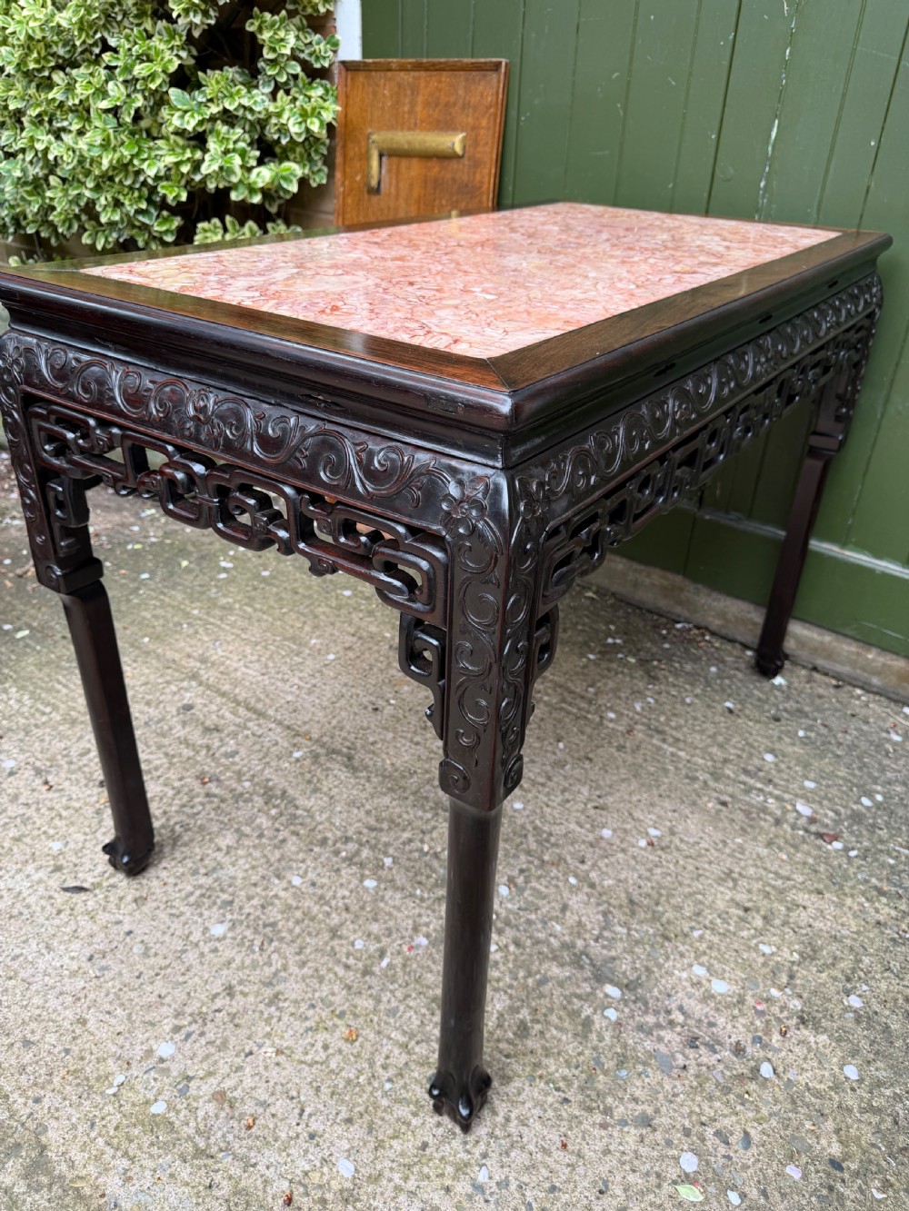 Late 19th-century Chinese Qing Dynasty dark hardwood centre table featuring an inset pink rouge marble rectangular top and intricately carved fretwork aprons. View XXIV
