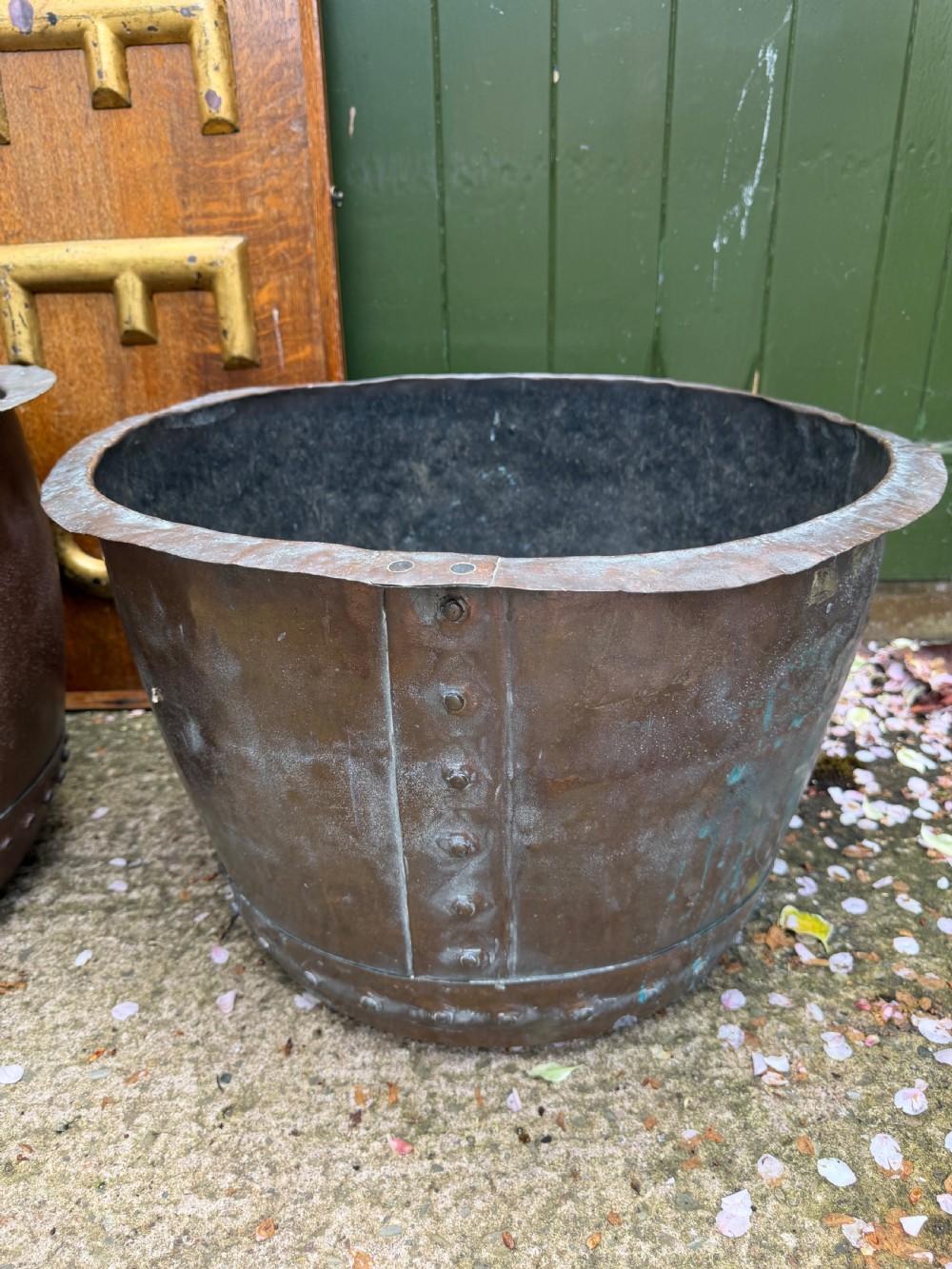A matched pair of 19th-century copper wash tubs with riveted seams, wide rolled rims, and natural verdigris oxidisation. View IV