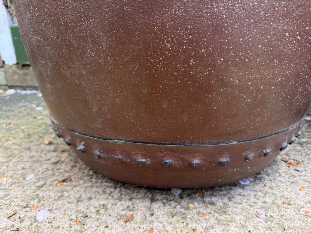 A matched pair of 19th-century copper wash tubs with riveted seams, wide rolled rims, and natural verdigris oxidisation. View VII