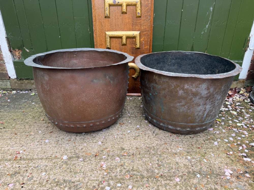 A matched pair of 19th-century copper wash tubs with riveted seams, wide rolled rims, and natural verdigris oxidisation. View X