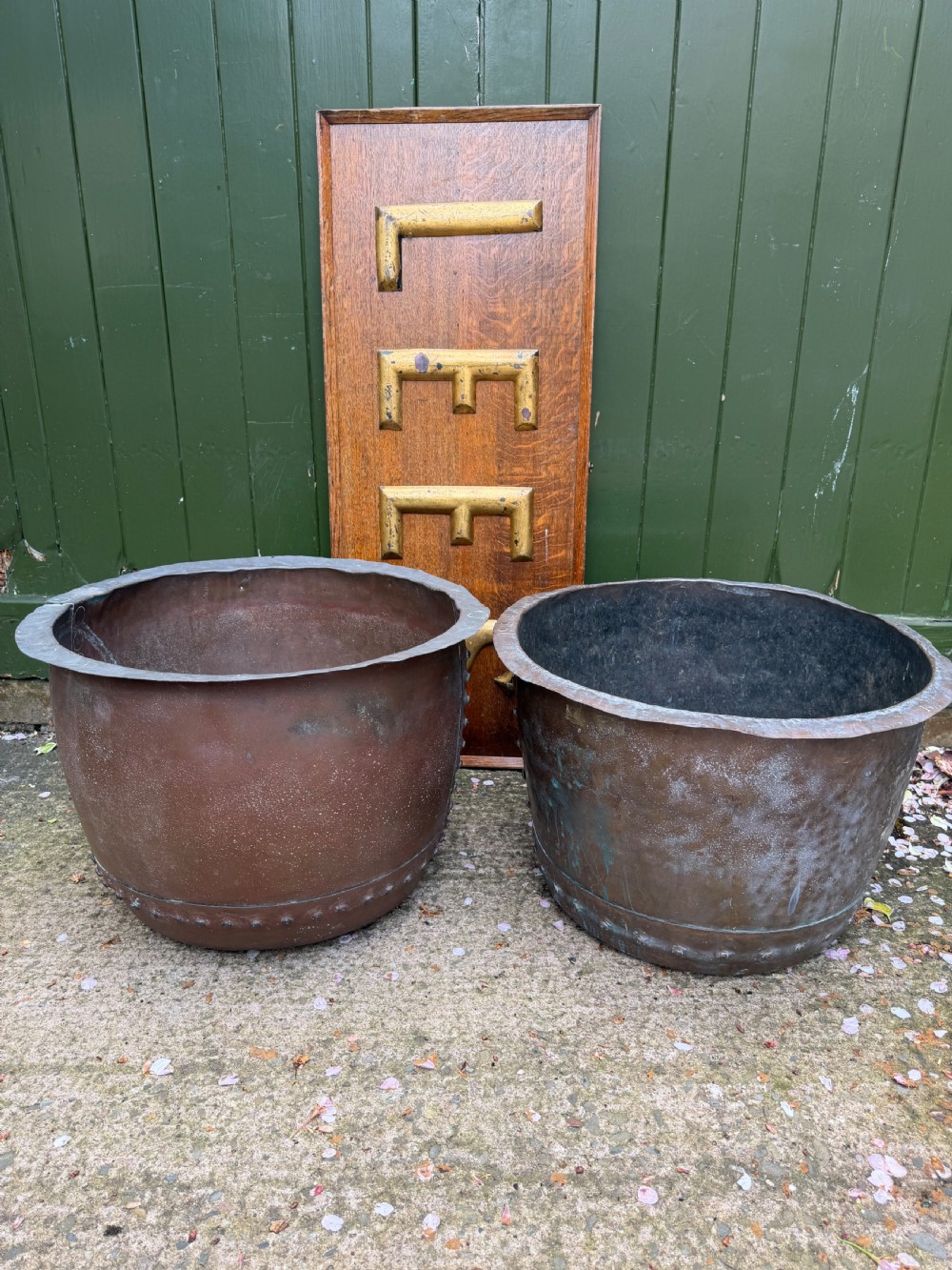 A matched pair of 19th-century copper wash tubs with riveted seams, wide rolled rims, and natural verdigris oxidisation. View XI