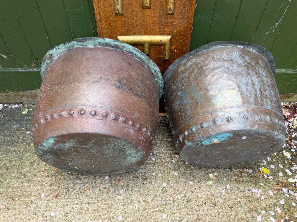 A matched pair of 19th-century copper wash tubs with riveted seams, wide rolled rims, and natural verdigris oxidisation. View XII