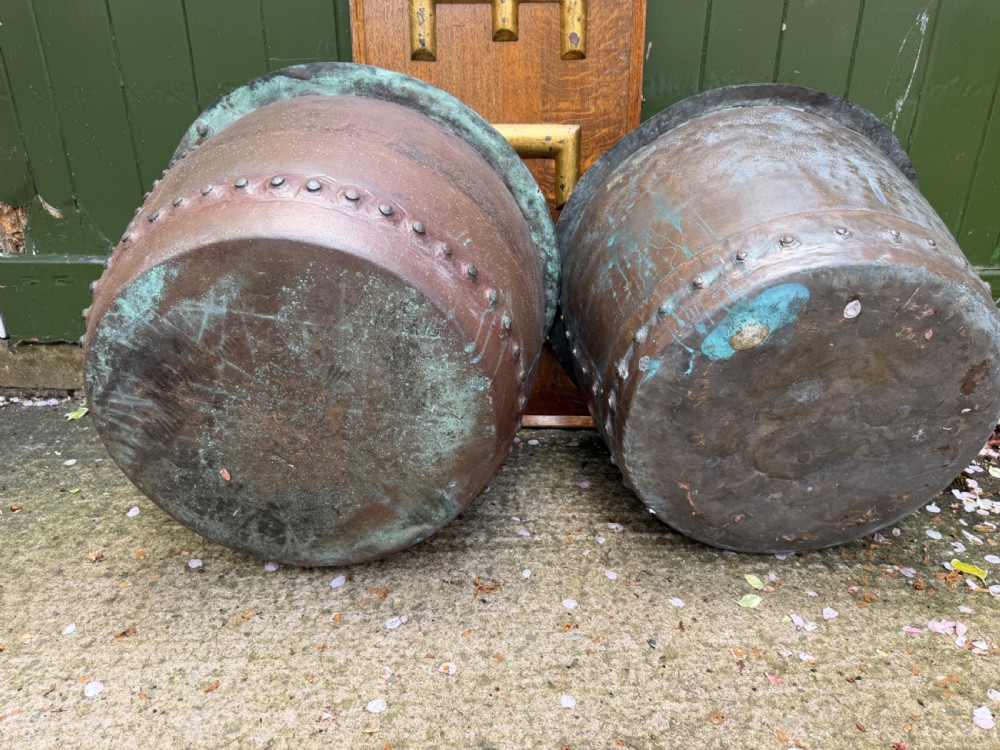A matched pair of 19th-century copper wash tubs with riveted seams, wide rolled rims, and natural verdigris oxidisation. View XIII