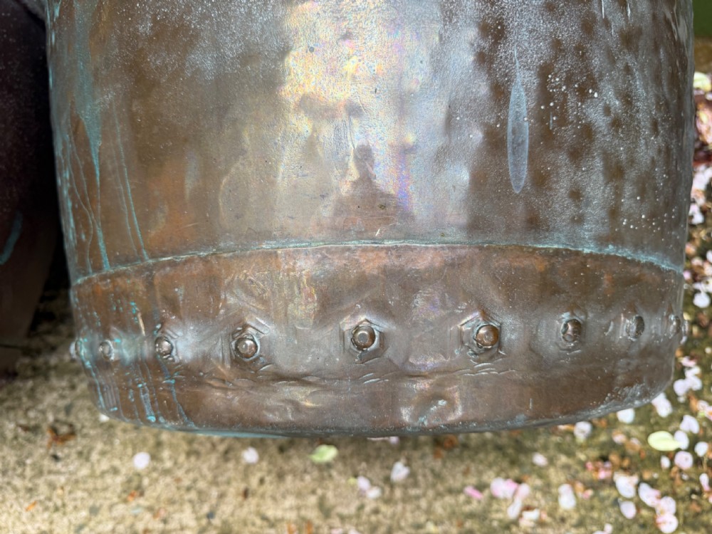 A matched pair of 19th-century copper wash tubs with riveted seams, wide rolled rims, and natural verdigris oxidisation. View XV