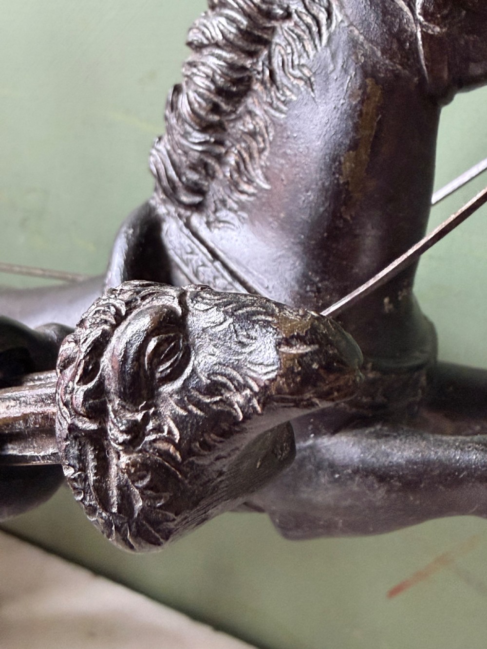 A mid-19th-century dark bronze sculpture depicting a Roman charioteer driving two rearing horses, mounted on a rectangular white marble plinth. View XIV