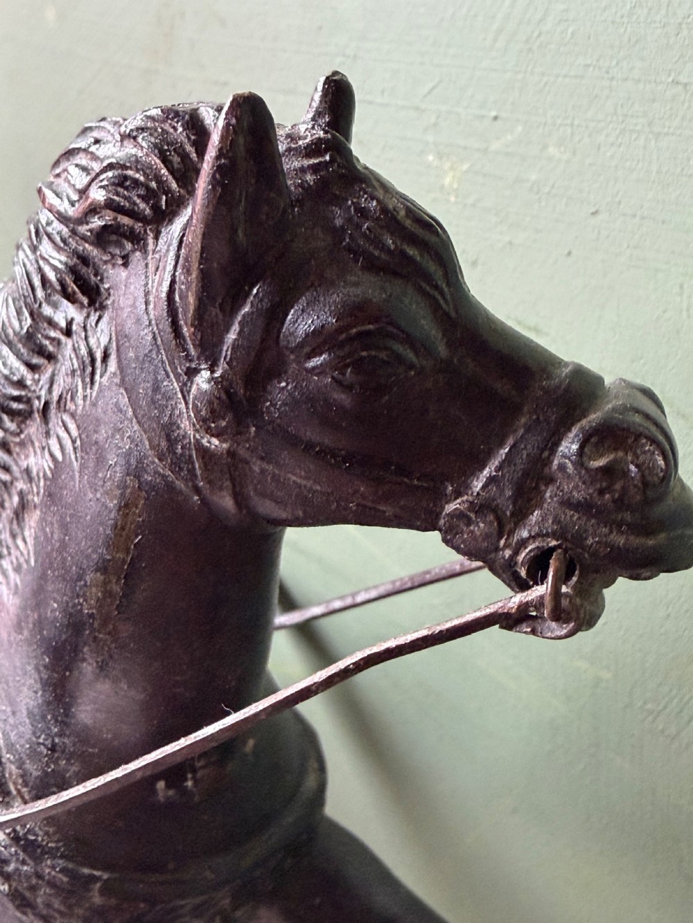 A mid-19th-century dark bronze sculpture depicting a Roman charioteer driving two rearing horses, mounted on a rectangular white marble plinth. View XIX