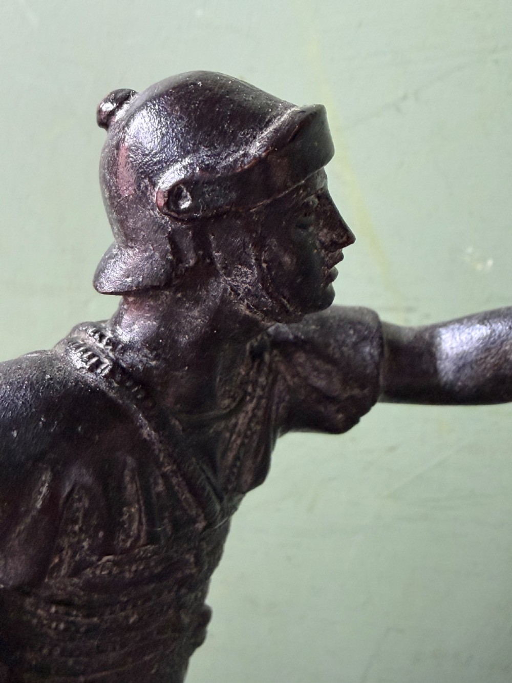 A mid-19th-century dark bronze sculpture depicting a Roman charioteer driving two rearing horses, mounted on a rectangular white marble plinth. View XXIV