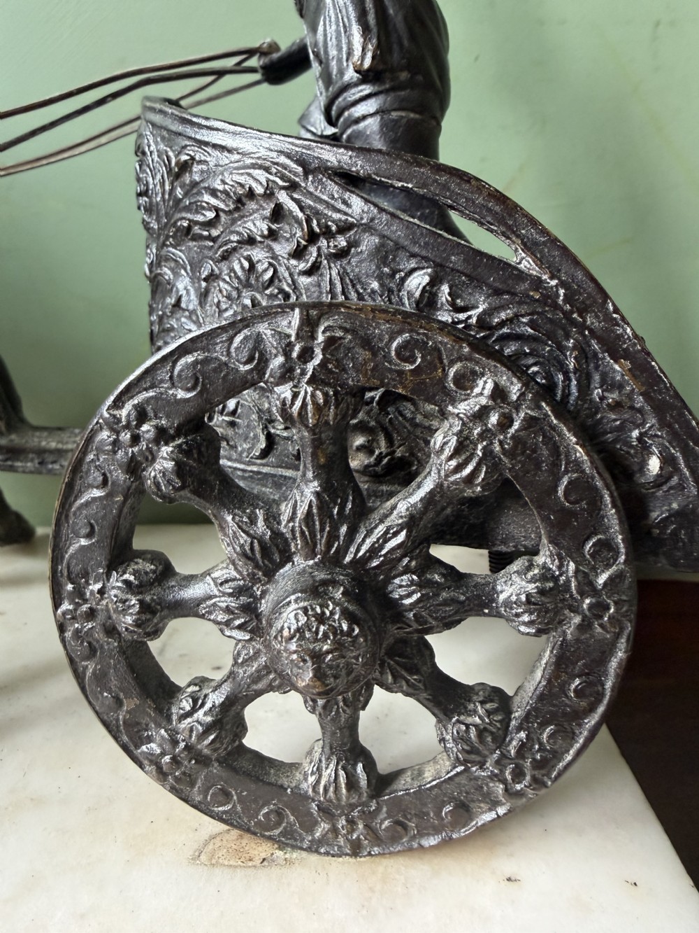 A mid-19th-century dark bronze sculpture depicting a Roman charioteer driving two rearing horses, mounted on a rectangular white marble plinth. View VII