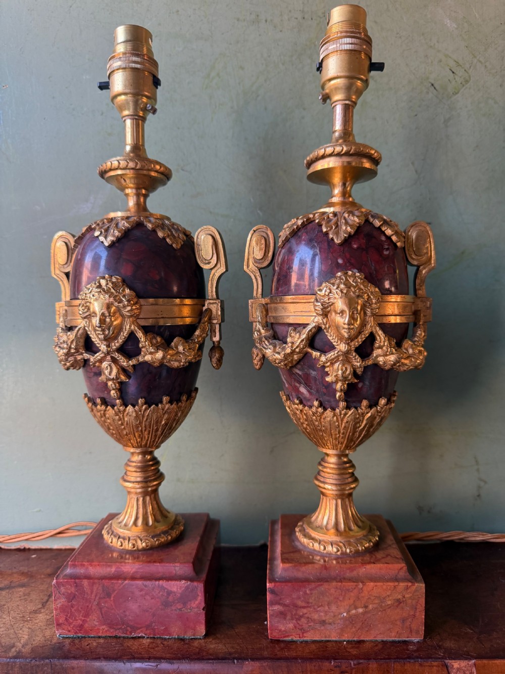 Pair of late C19th French ormolu-mounted rouge marble lamps in the C18th Louis XVI period style.