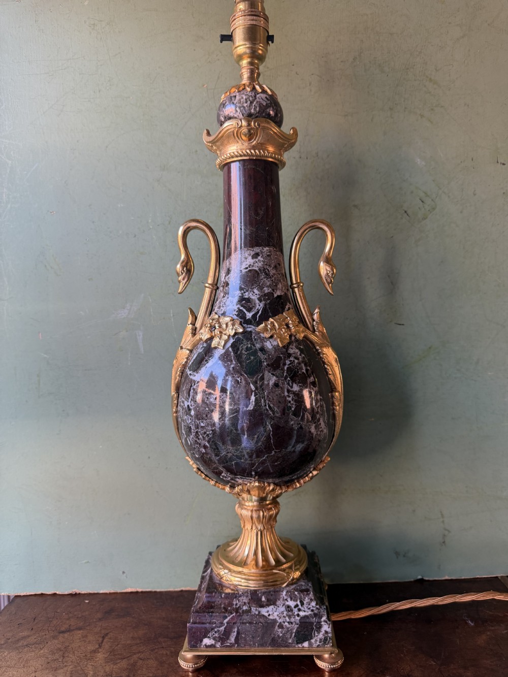 A pair of urn-shaped burgundy marble table lamps featuring gilded bronze swan handles and square pedestals. View XI