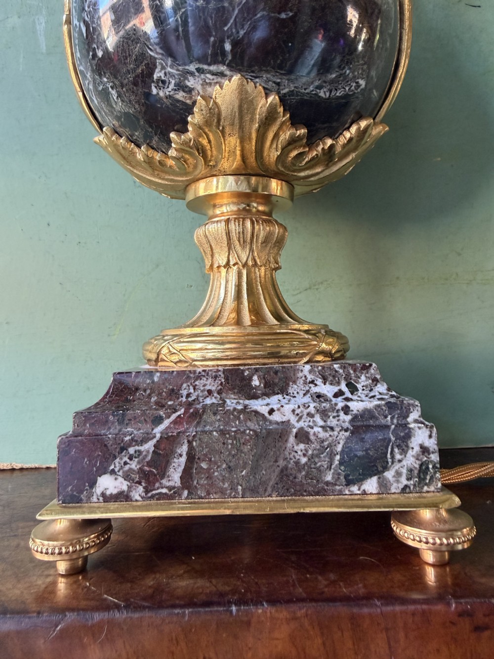 A pair of urn-shaped burgundy marble table lamps featuring gilded bronze swan handles and square pedestals. View XIV