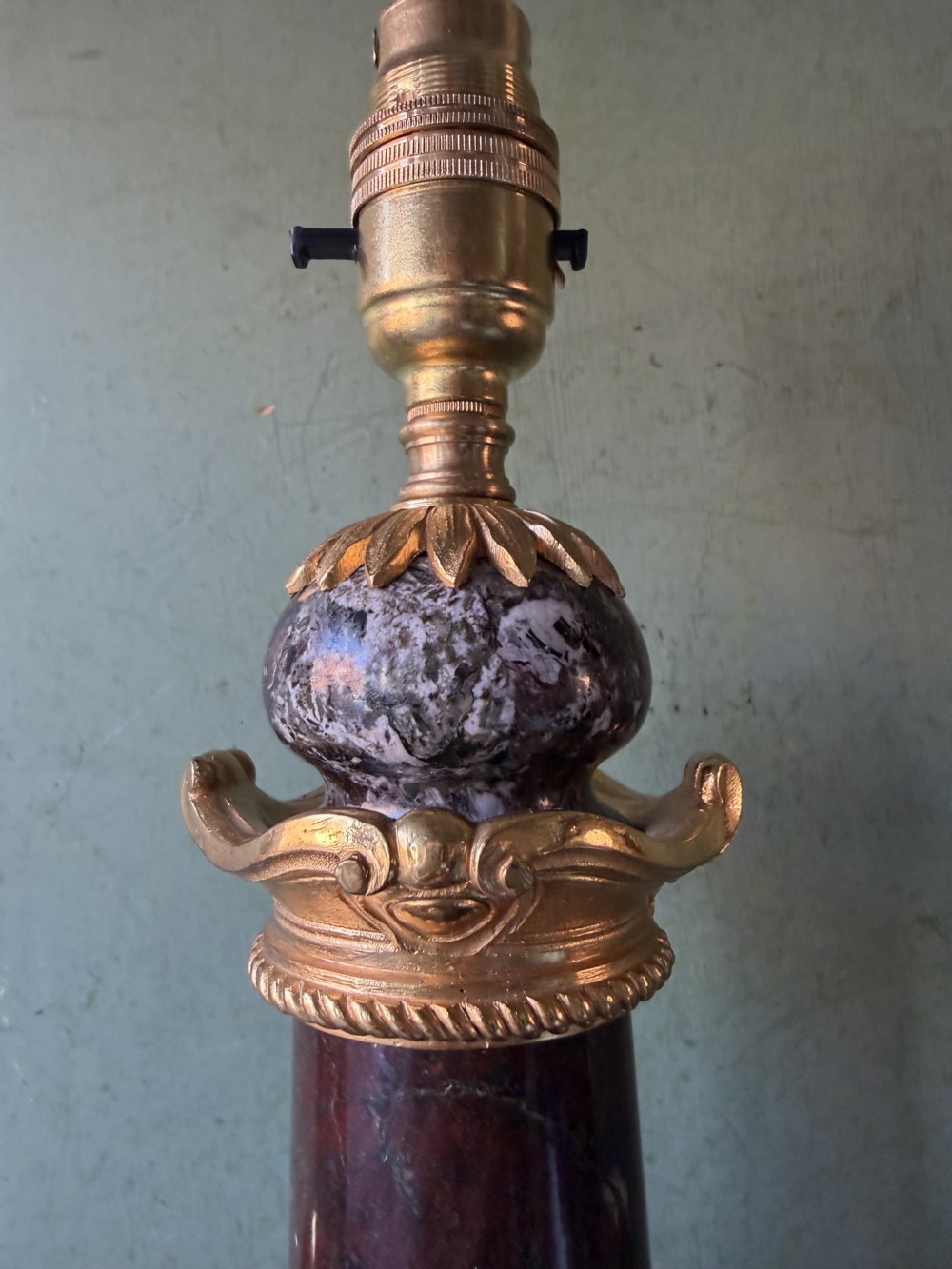 A pair of urn-shaped burgundy marble table lamps featuring gilded bronze swan handles and square pedestals. View XV
