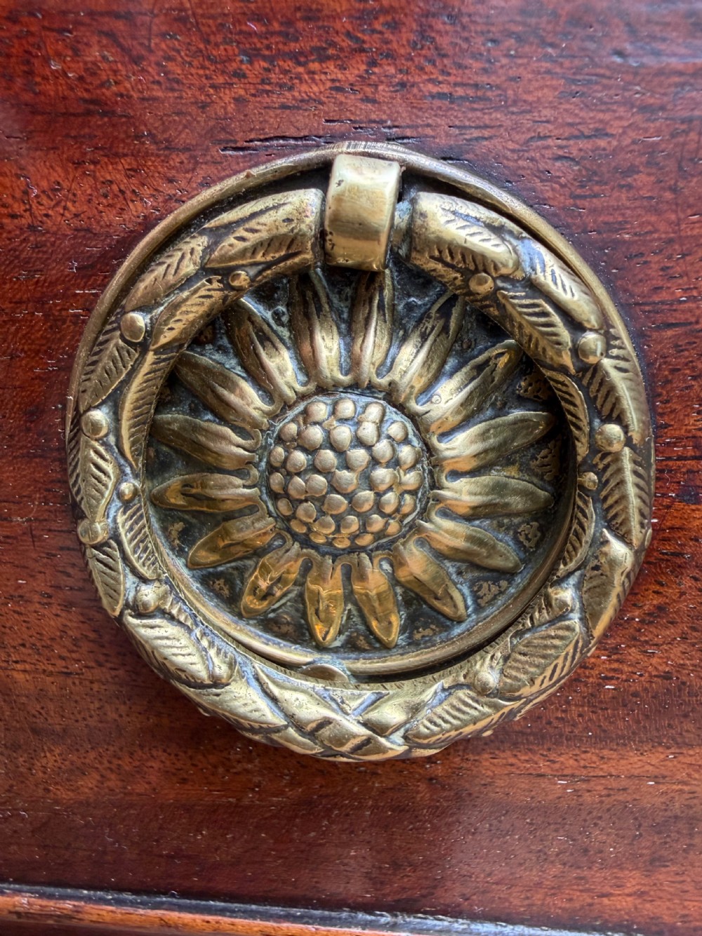 Early 19th-century George IV mahogany writing table featuring a long frieze drawer with brass rosette handles and reeded turned legs on castors. View XX