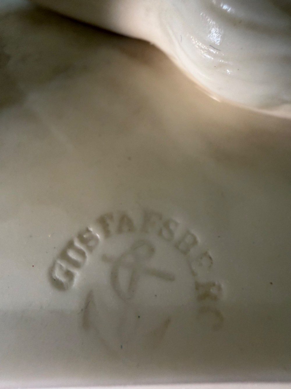 A white Parian porcelain Neoclassical sculpture depicting a reclining female figure mounted on the back of a panther on a rectangular plinth. View VIII