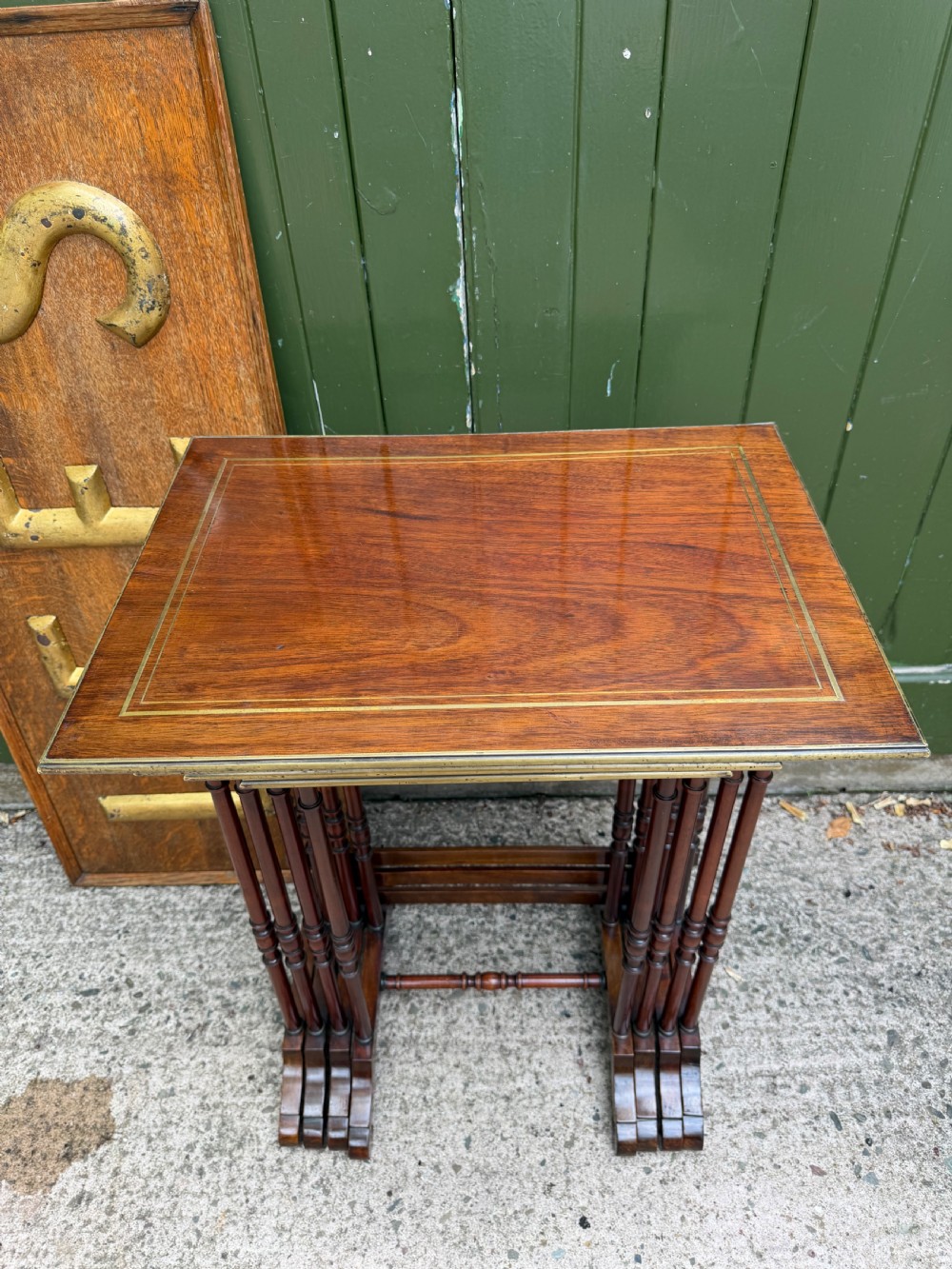 An early nineteenth-century Regency quartetto set of four rosewood nesting tables with brass line inlay and slender turned legs. View IV