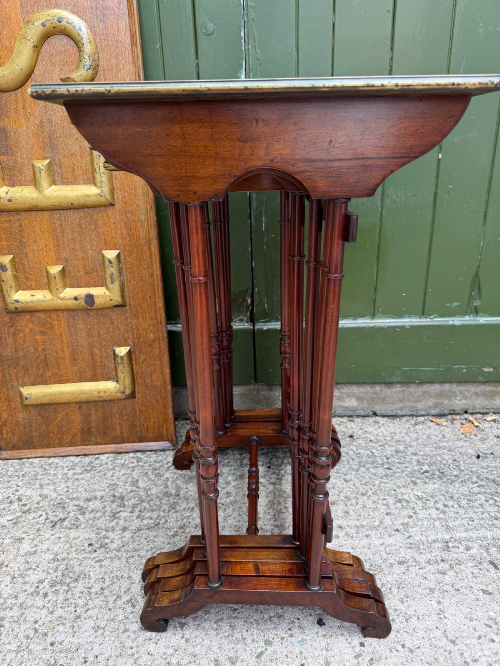 An early nineteenth-century Regency quartetto set of four rosewood nesting tables with brass line inlay and slender turned legs. View VII