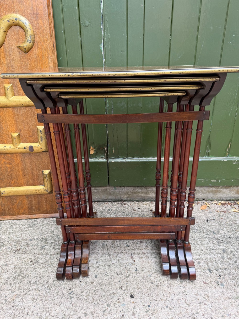 An early nineteenth-century Regency quartetto set of four rosewood nesting tables with brass line inlay and slender turned legs. View VIII