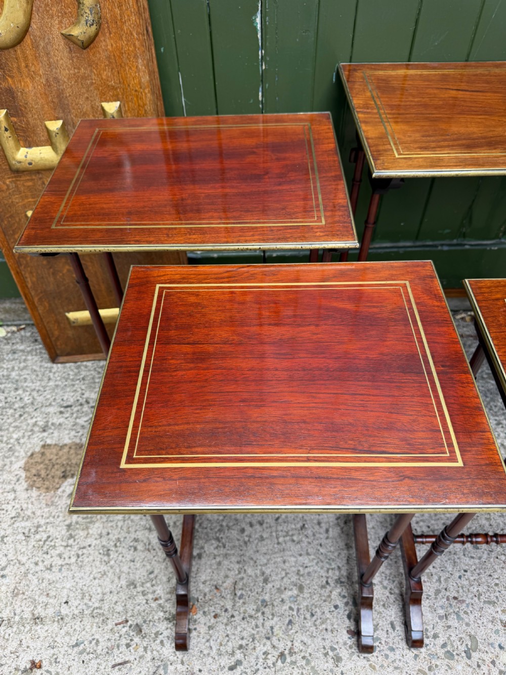 An early nineteenth-century Regency quartetto set of four rosewood nesting tables with brass line inlay and slender turned legs. View X