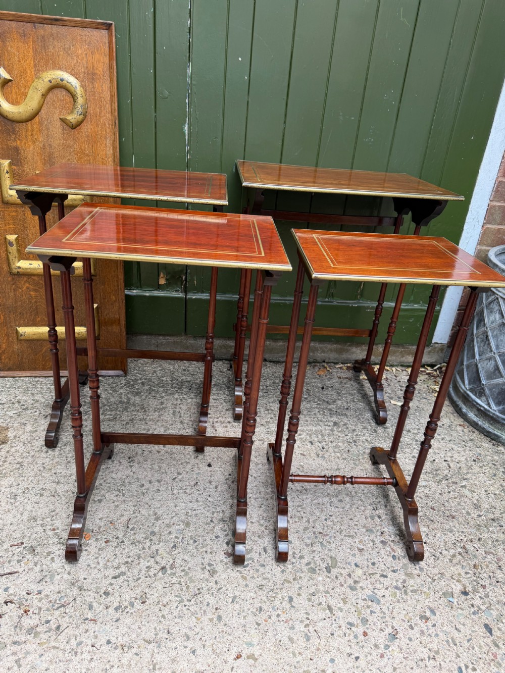 An early nineteenth-century Regency quartetto set of four rosewood nesting tables with brass line inlay and slender turned legs. View XV