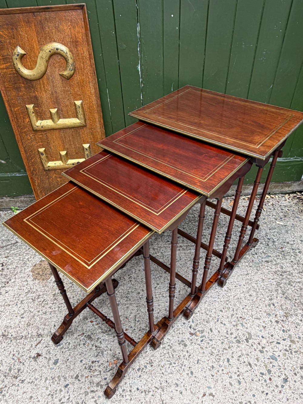 An early nineteenth-century Regency quartetto set of four rosewood nesting tables with brass line inlay and slender turned legs. View XVIII