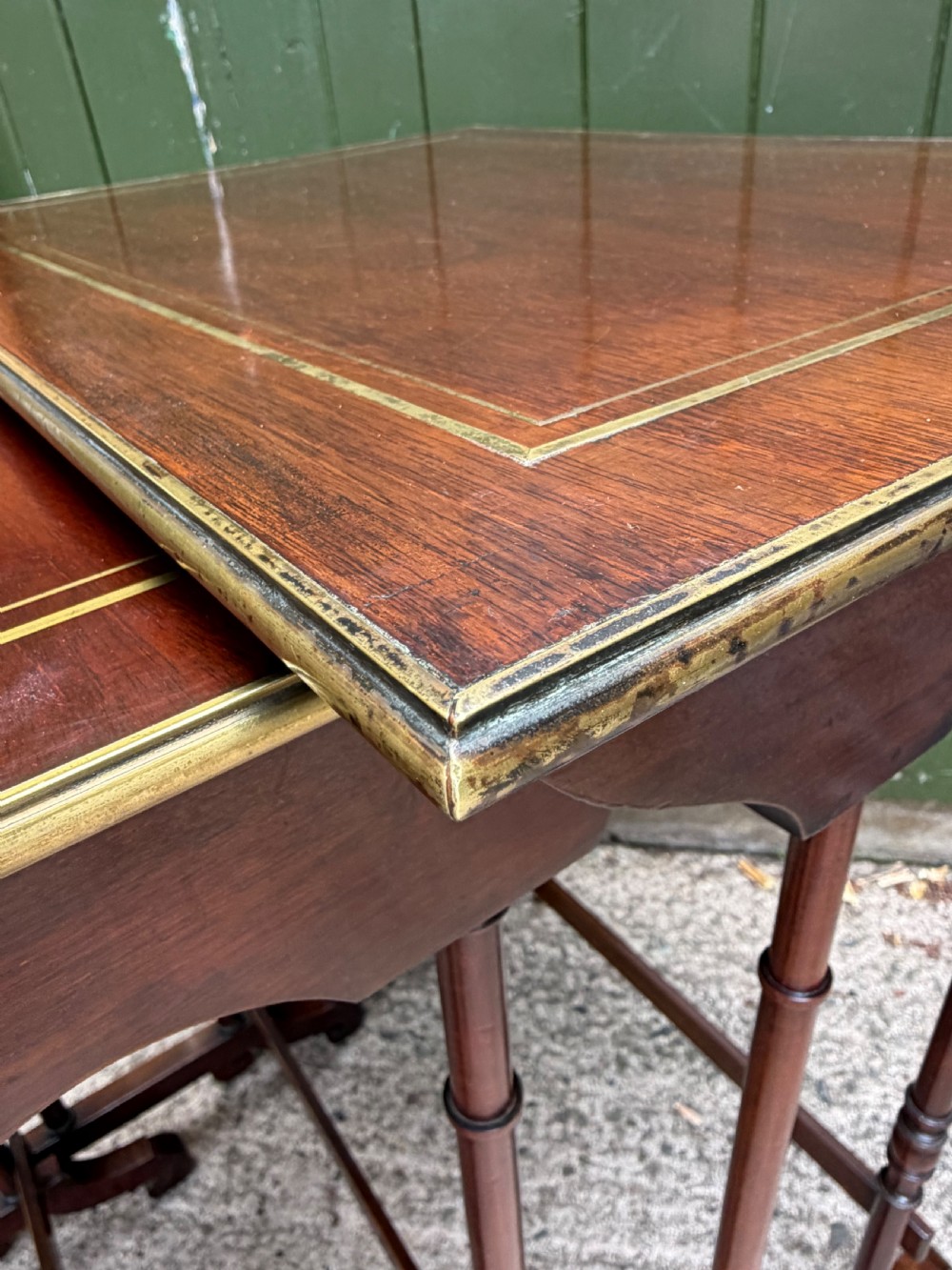 An early nineteenth-century Regency quartetto set of four rosewood nesting tables with brass line inlay and slender turned legs. View XXI