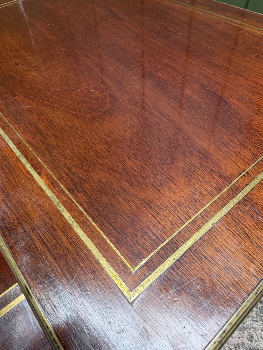 An early nineteenth-century Regency quartetto set of four rosewood nesting tables with brass line inlay and slender turned legs. View XXII