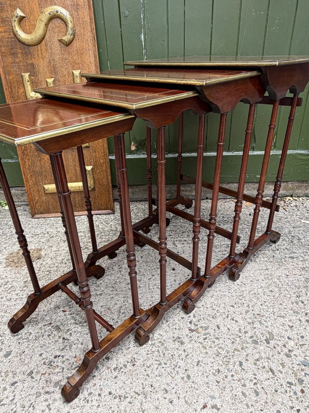 An early nineteenth-century Regency quartetto set of four rosewood nesting tables with brass line inlay and slender turned legs. View XXIV