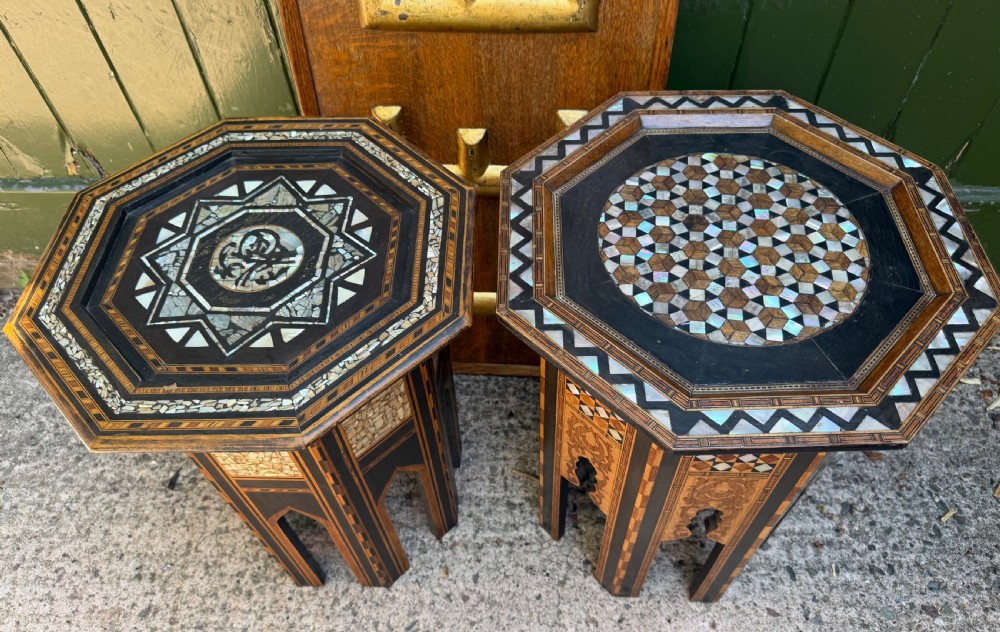 A matched pair of late 19th-century octagonal Moorish style occasional tables featuring detailed geometric mother-of-pearl and bone marquetry inlays with arched leg cutouts. View II