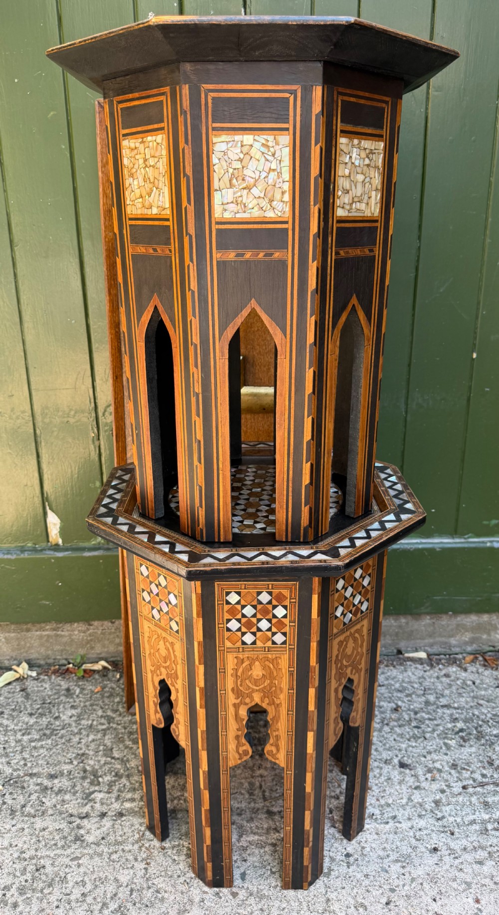 A matched pair of late 19th-century octagonal Moorish style occasional tables featuring detailed geometric mother-of-pearl and bone marquetry inlays with arched leg cutouts. View IX