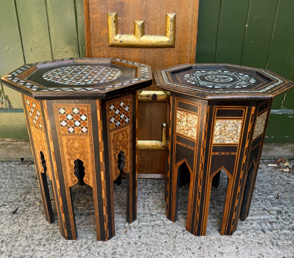 A matched pair of late 19th-century octagonal Moorish style occasional tables featuring detailed geometric mother-of-pearl and bone marquetry inlays with arched leg cutouts. View XI