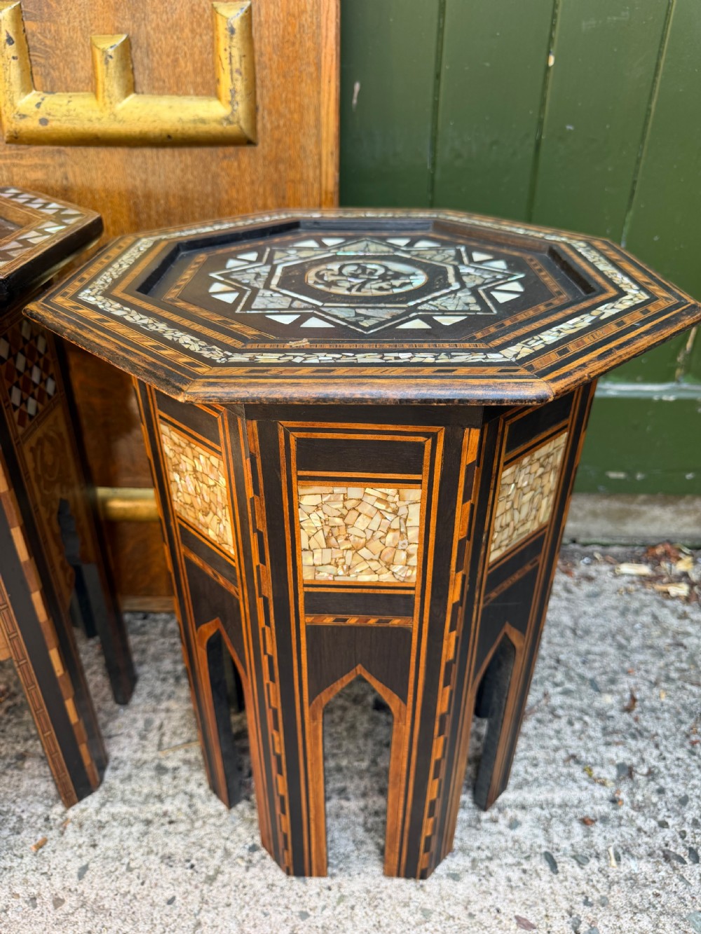 A matched pair of late 19th-century octagonal Moorish style occasional tables featuring detailed geometric mother-of-pearl and bone marquetry inlays with arched leg cutouts. View XII
