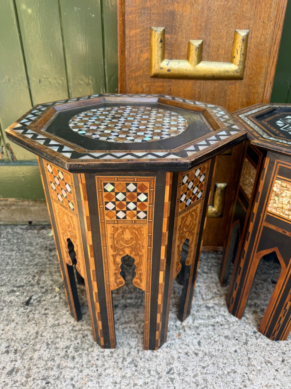 A matched pair of late 19th-century octagonal Moorish style occasional tables featuring detailed geometric mother-of-pearl and bone marquetry inlays with arched leg cutouts. View XIII