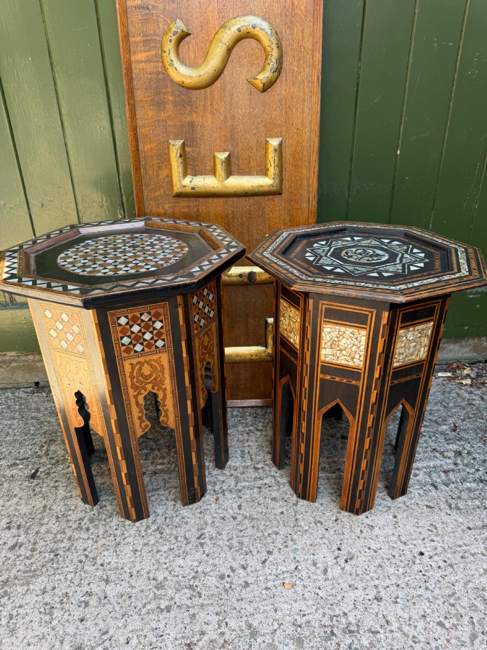 A matched pair of late 19th-century octagonal Moorish style occasional tables featuring detailed geometric mother-of-pearl and bone marquetry inlays with arched leg cutouts. View XIV