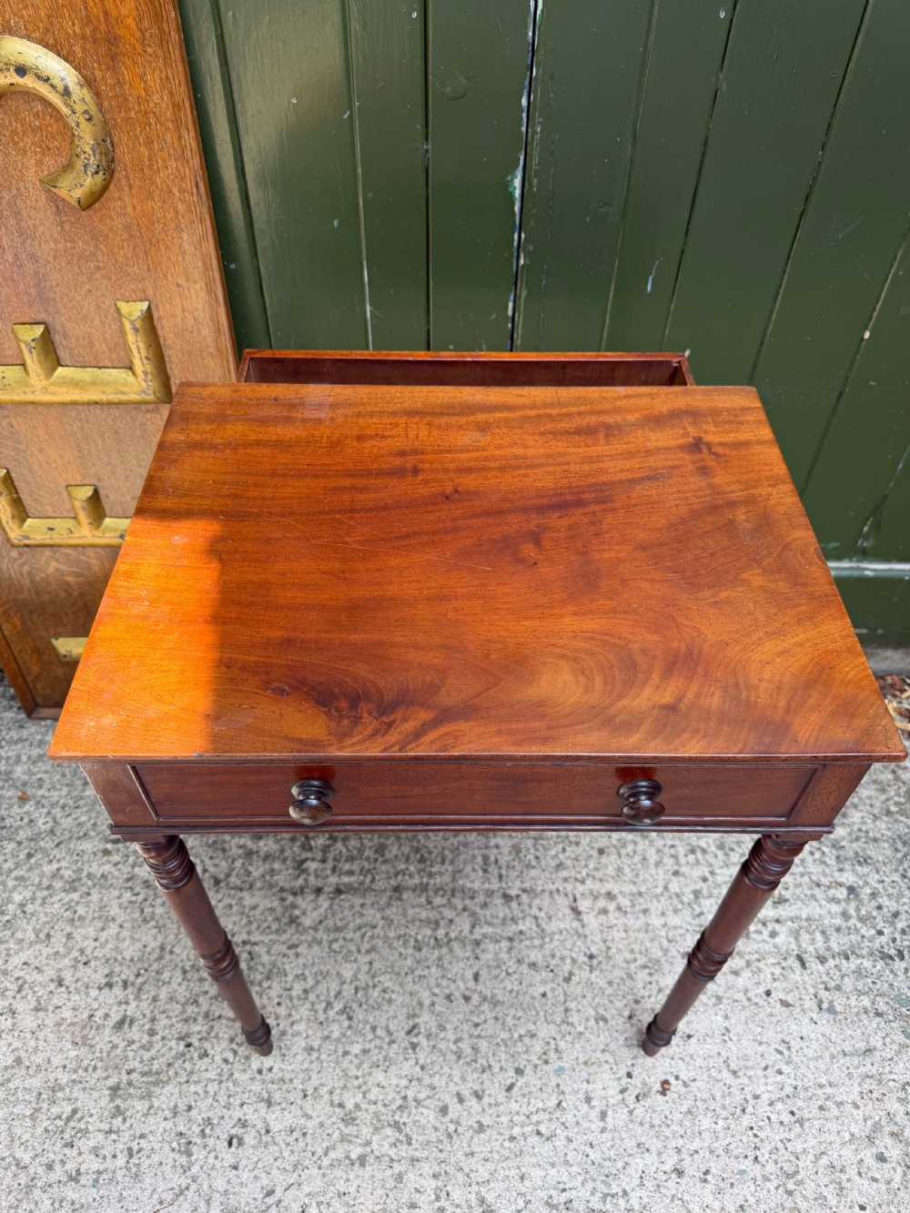 An early 19th-century George III period rectangular mahogany side table featuring a single drawer with turned wood handles and slender ring-turned legs. View VI