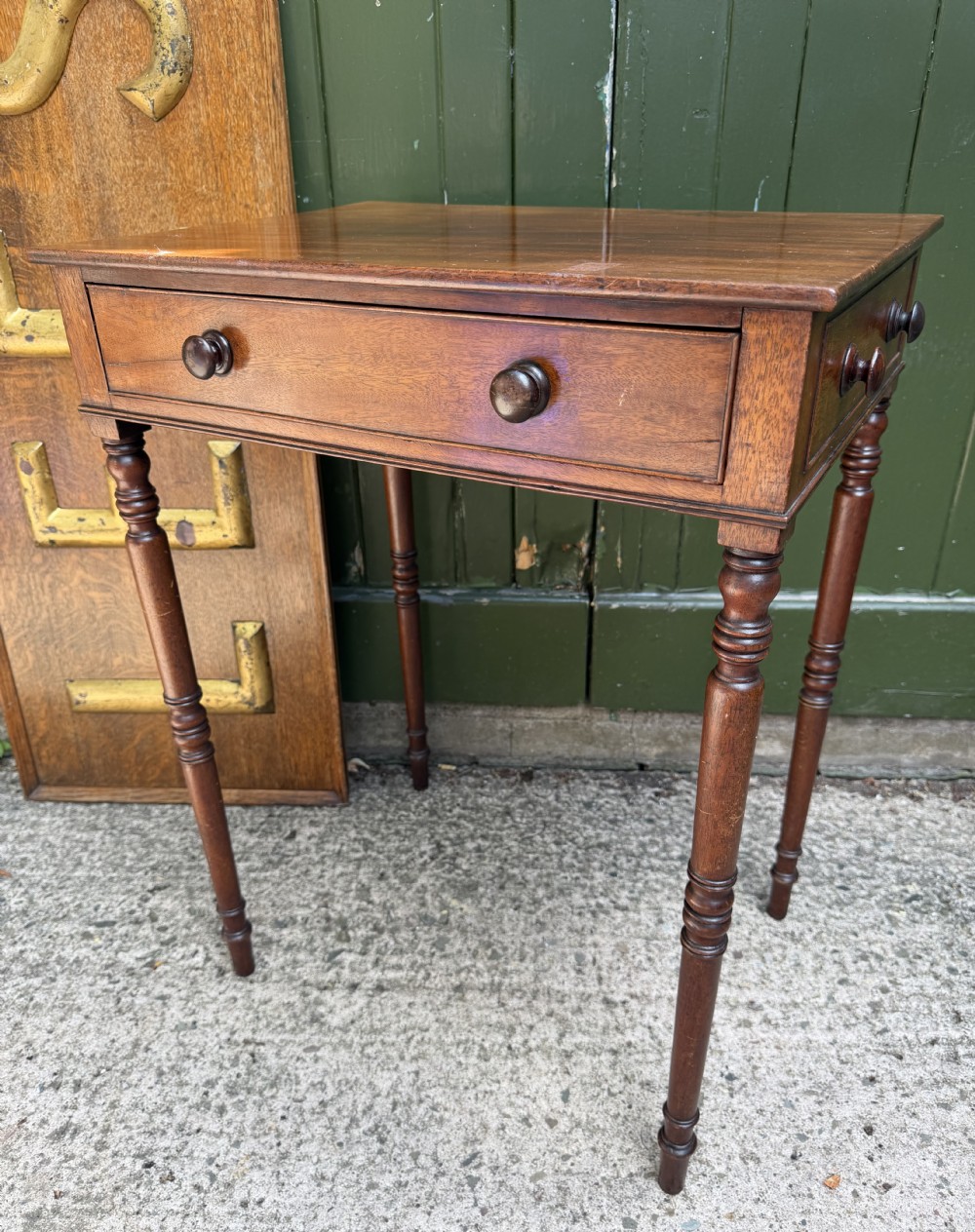 An early 19th-century George III period rectangular mahogany side table featuring a single drawer with turned wood handles and slender ring-turned legs. View XI