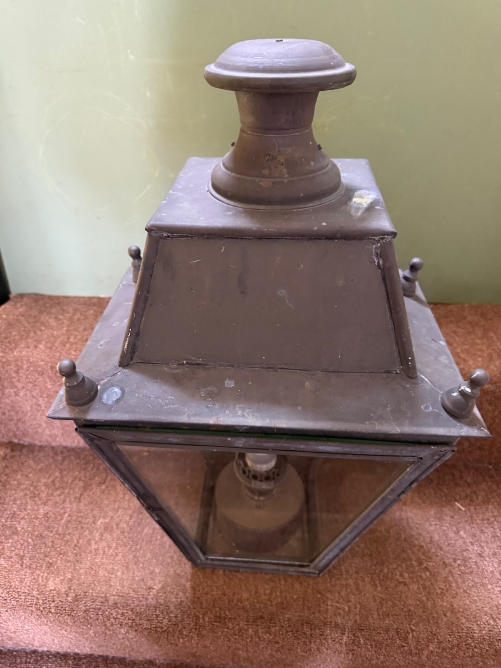 A pair of late nineteenth to early twentieth-century tapered copper wall lanterns with glass panels, top chimneys, and a dark verdigris finish. View II