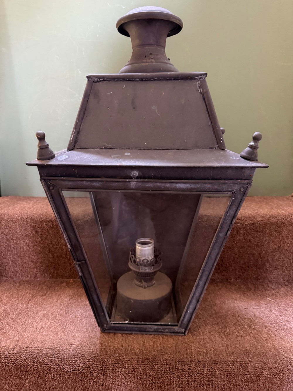 A pair of late nineteenth to early twentieth-century tapered copper wall lanterns with glass panels, top chimneys, and a dark verdigris finish. View III