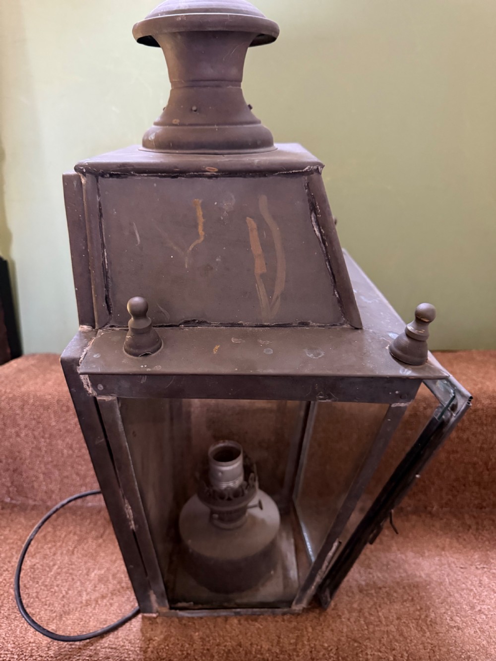 A pair of late nineteenth to early twentieth-century tapered copper wall lanterns with glass panels, top chimneys, and a dark verdigris finish. View XI