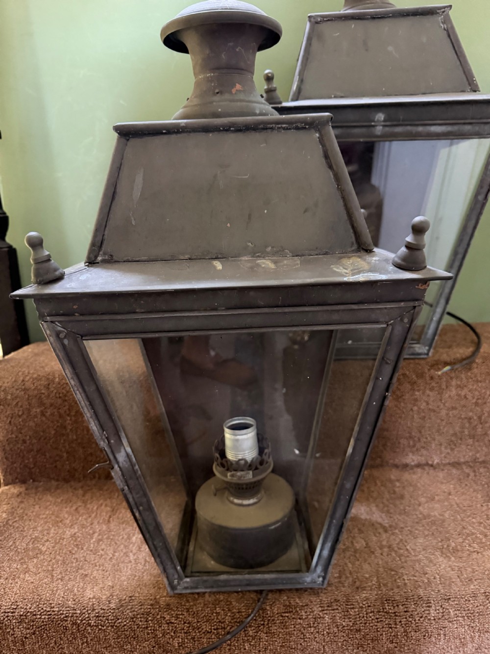 A pair of late nineteenth to early twentieth-century tapered copper wall lanterns with glass panels, top chimneys, and a dark verdigris finish. View XIV