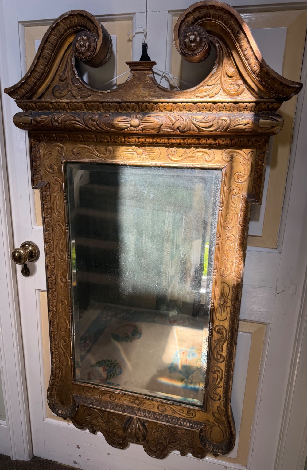 Mid 19th-century George II style carved giltwood pier mirror featuring a swan-neck pediment and carved shell apron. View III