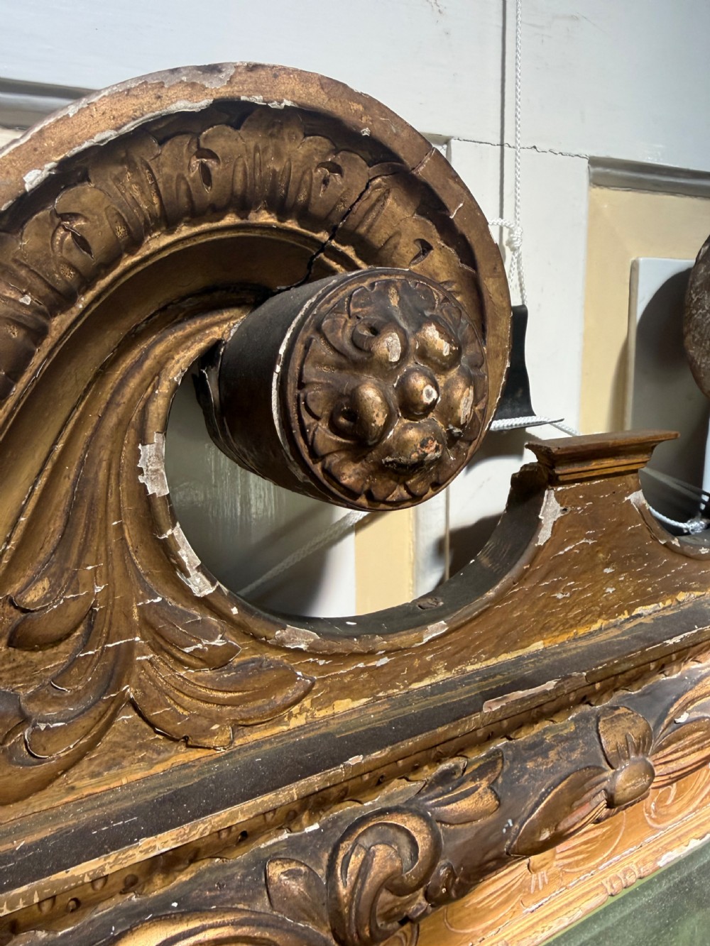 Mid 19th-century George II style carved giltwood pier mirror featuring a swan-neck pediment and carved shell apron. View V