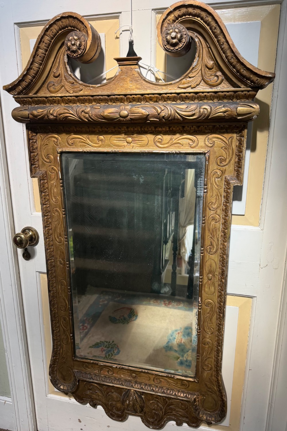 Mid 19th-century George II style carved giltwood pier mirror featuring a swan-neck pediment and carved shell apron. View VIII
