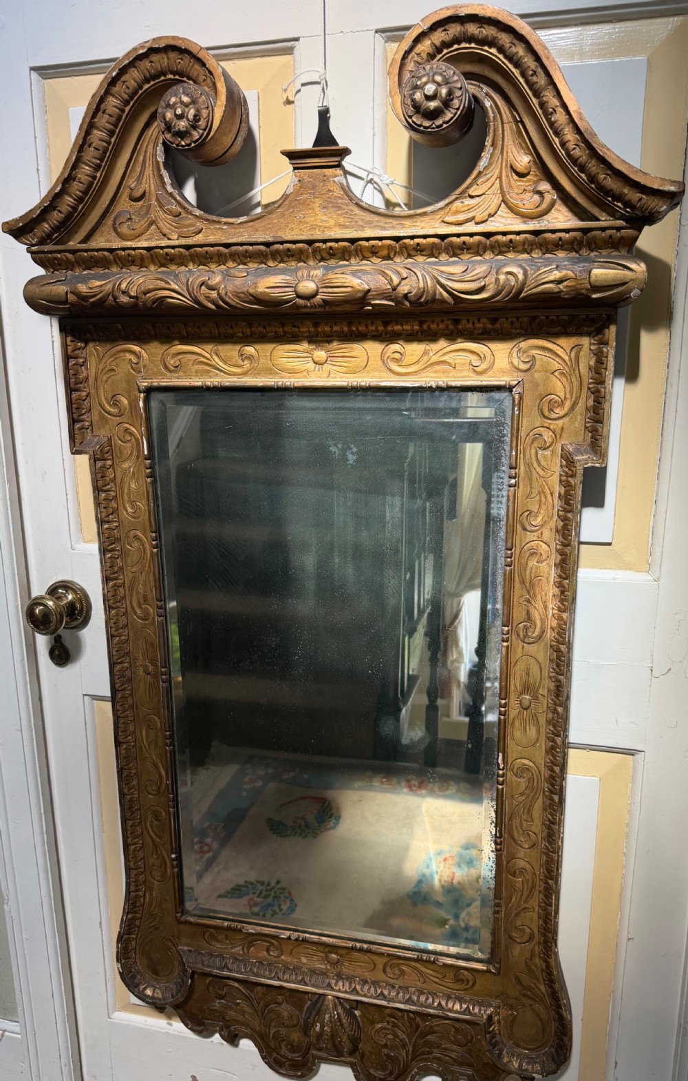 Mid 19th-century George II style carved giltwood pier mirror featuring a swan-neck pediment and carved shell apron. View IX