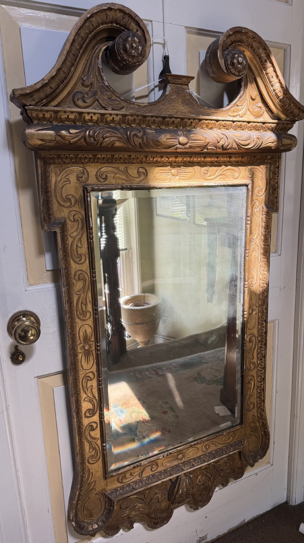 Mid 19th-century George II style carved giltwood pier mirror featuring a swan-neck pediment and carved shell apron. View XII